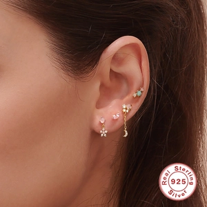 925 sterling silver flower and moon-star chain stud earring set worn on ear
