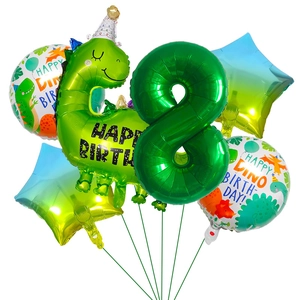 Macro detail of dinosaur birthday balloons set with green number 8 and star shapes
