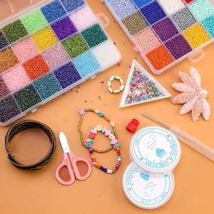 Detailed 24-grid DIY bead kit with vibrant seed beads, elastic cord and crafting tools