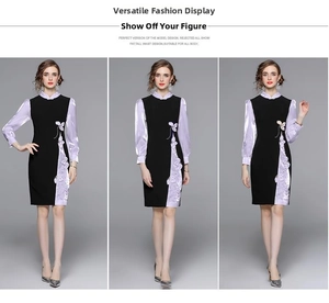 Dettaglio dell'elegante abito cheongsam nero con maniche in raso lilla e ricami a farfalla