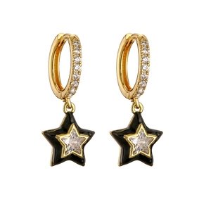 Detail of gold hoop earrings with black enamel star charms and sparkling zircon stones