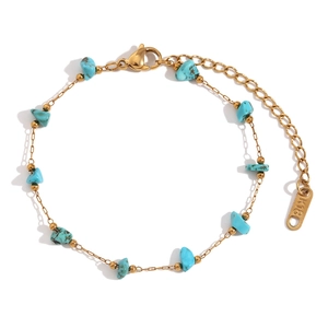 Macro shot of 18K gold plated stainless steel necklace with sky blue natural stones