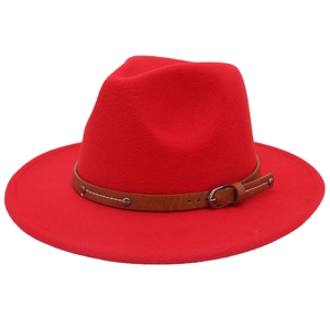 Detail of red wool fedora crown featuring a brown faux leather belt with metal buckle