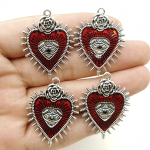 Gothic punk wild rose heart pendant with red eye enamel inlay in silver finish