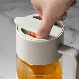 Distributeur d'huile 550ml en verre borosilicate avec échelle graduée et bouton poussoir
