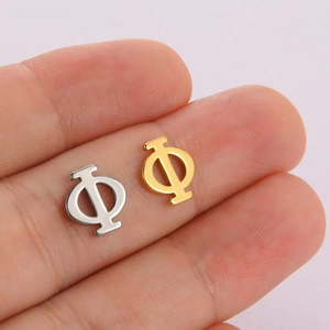 Golden and silver Greek letter Phi stainless steel charm pendants shown on a finger