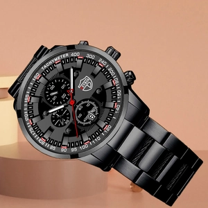 Detail of black chronograph watch with stainless steel band and luminous dial