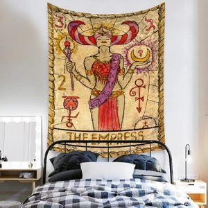 Detail view of The Empress tarot tapestry on bedroom wall with vintage bohemian patterns
