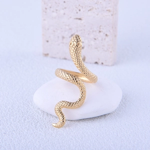 Adjustable golden stainless steel snake ring with fine scale texture on white stones