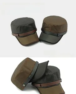 Flat top military caps in dark brown and grey featuring leather decorative straps