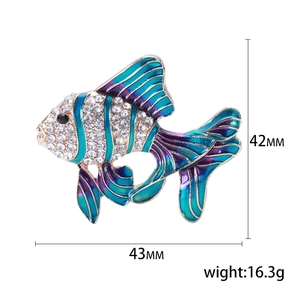 Macro shot of 43mm tropical fish brooch with purple enamel and white crystals