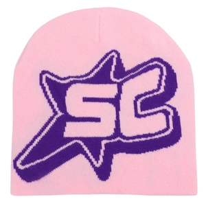 Close-up of pink beanie featuring a purple star and SC jacquard knit pattern