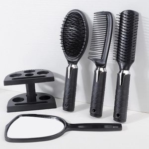 Black 5-piece hair styling set with paddle brushes, mirror and holder stand