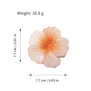 Macro shot of colorful flower hair claw showing 7.7 cm size and 26.9 g weight details