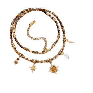 Ethnic beaded necklace with tiger eye beads and celestial sun star charms in gold finish