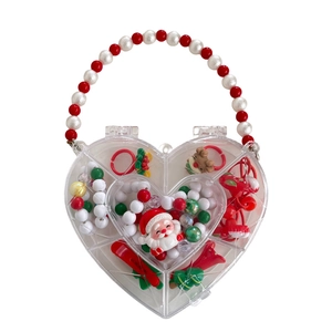 Christmas jewelry set for kids with Santa and reindeer motifs in a heart-shaped gift box