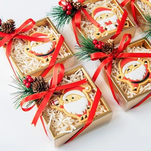 Christmas Santa cookie molds set with festive pine cone decor and red ribbons
