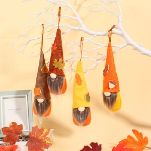 Set of four autumn themed gnome hanging ornaments with pumpkins and maple leaves decoration