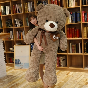 Detail of a large 1.8m brown teddy bear with Love heart embroidery and silk bow tie
