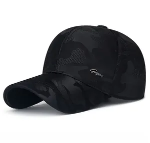 Detail of camoufalge pattern with silver metal logo on dark grey outdoor baseball cap