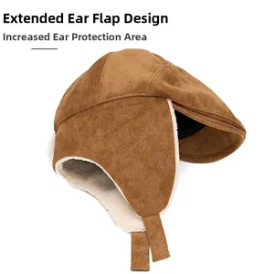 Detail of brown suede winter beret with thick white fleece lining and long earflaps