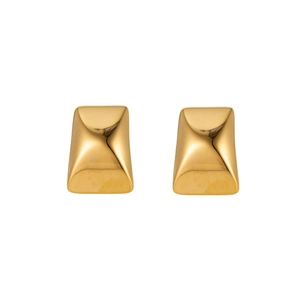Macro shot of geometric trapezoid gold earrings with a high-polished metallic finish