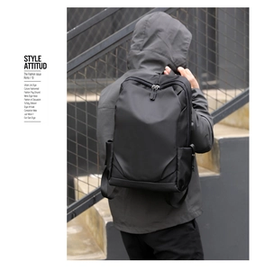 Fashionable black Oxford laptop backpack shown on model with urban street style backdrop