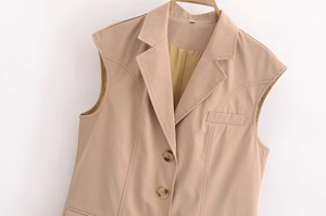 Detail of khaki sleeveless blazer vest showing lapel collar and single-breasted buttoning