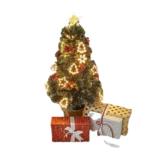 Fiber optic Christmas tree with glowing star topper, warm LED lights, and gift boxes