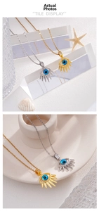 Macro detail of Evil Eye pendant with blue stone and gold plating on white ceramic plate