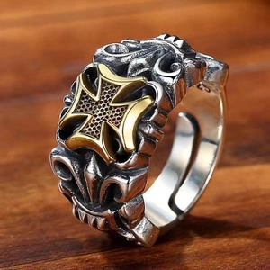 Detailed macro shot of vintage silver ring with gold Maltese cross and S925 engraving
