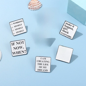 Set of 7 square white enamel pins with inspirational quotes on light blue background