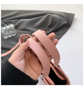 Detail shot of the widened pink leather handle featuring precise stitching and edge oil finish