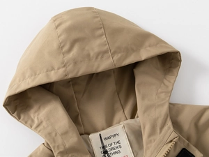 Close-up of khaki hooded jacket neckline showing smooth zipper and woven brand label