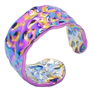 Macro detail of adjustable iridescent rainbow ring with unique irregular hammered texture