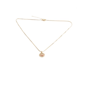 Detail of gold-plated pendant necklace with micro-pave cubic zirconia smiley face charm