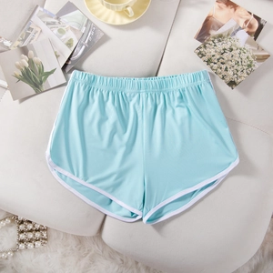 Detail of sky blue sports shorts featuring white dolphin-hem contrast piping and elastic waist