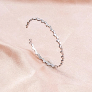 Polished silver stainless steel C-shape open cuff bracelet with bead texture on pink silk