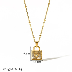 Detailed view of gold padlock pendant showing size dimensions and star engraving