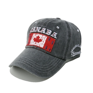 Close-up of vintage charcoal baseball cap with Canada flag patch and embroidery detail