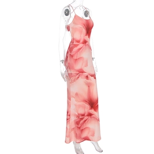 Close-up of pink floral print texture on sleek sleeveless maxi dress fabric