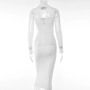 Back view of white bodycon dress with sheer mesh sleeves and hollow-out design detail