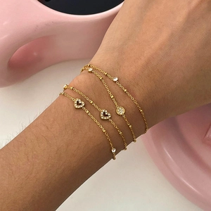 Luxurious layered heart-shaped gold chain bracelets with white zircon accents for women