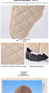 Detail view of beige winter hat showing quilted fabric, plush lining and windproof buckle