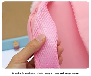 Breathable pink honeycomb mesh shoulder strap on a lightweight cartoon bear backpack