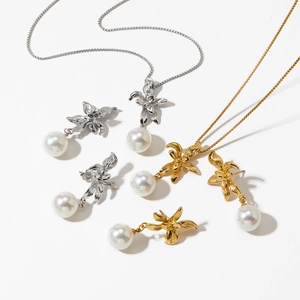 Elegant bow knot pearl necklace and earrings set in silver and gold finish steel