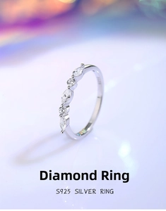 Macro detail of S925 sterling silver stamp and sparkling pavé cubic zirconia settings