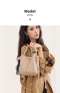 Detail of beige bucket bag with lychee texture, silk scarf, and gold metal feet