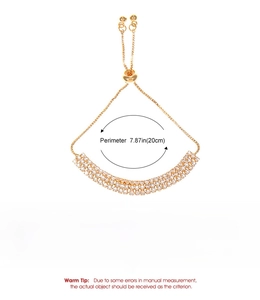 Detailed view of triple-row gold tennis bracelet with adjustable slider clasp