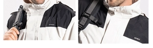 Detail of outdoor sport jacket with SPIRIT logo and contrast black and white stitching